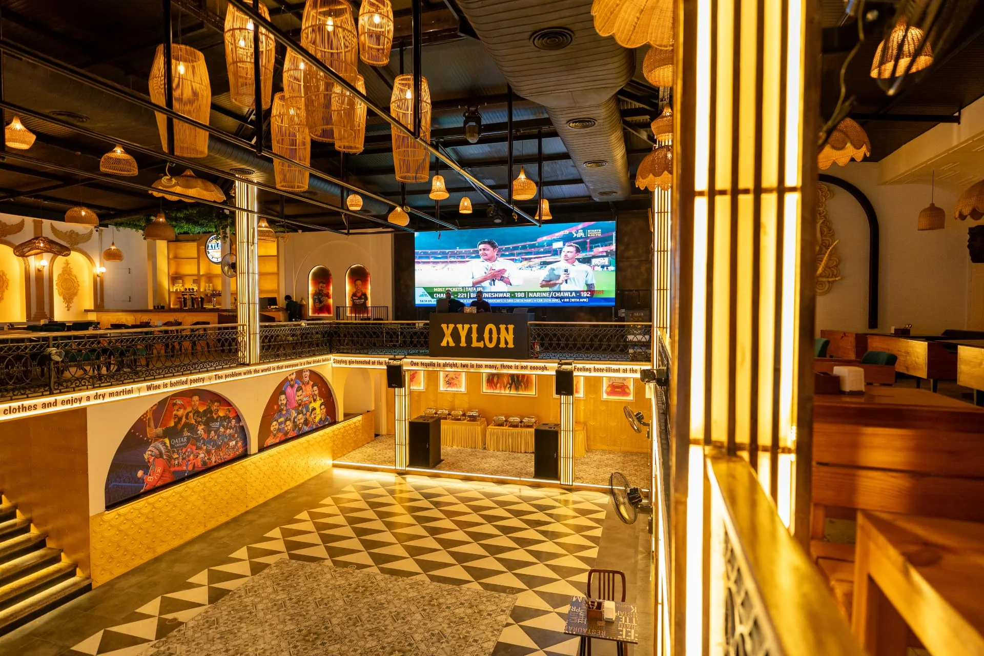 XYLON bar and dining room glowing amber after dark